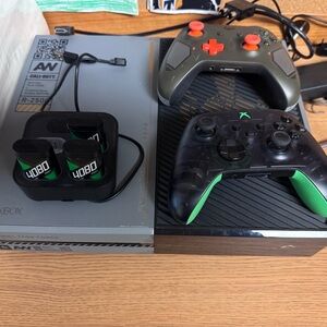 Microsoft Xbox Console with Black and Green Controllers